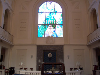 Stained glass window above the altar in the Synagogue of Bologna.