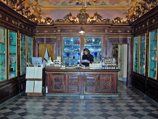 Knowledgeable staff in the original showrooms at Santa Maria Novella Pharmacy in Firenze, Italy.